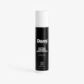 A single bottle of Domi Peptide Barrier Moisturizer on a clean white background. The bottle is black with white text and a white cap, with a soft shadow underneath.