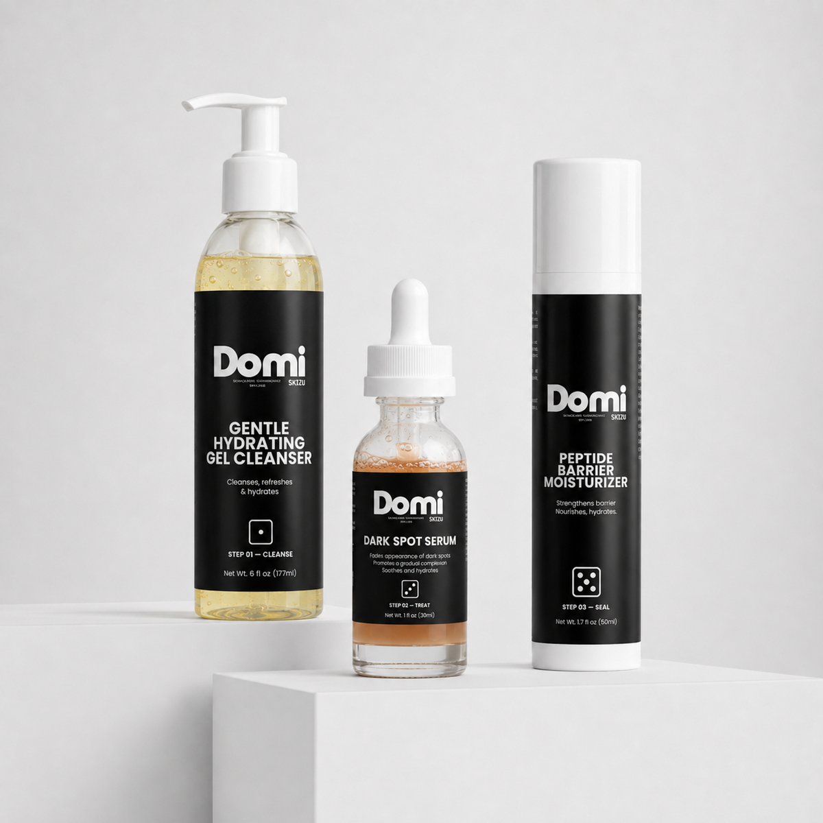 Three Domi skincare products arranged on a white pedestal against a light gray studio background: a large pump bottle of Gentle Hydrating Gel Cleanser, a small dropper bottle of Dark Spot Serum, and a tall aerosol can of Peptide Barrier Moisturizer.