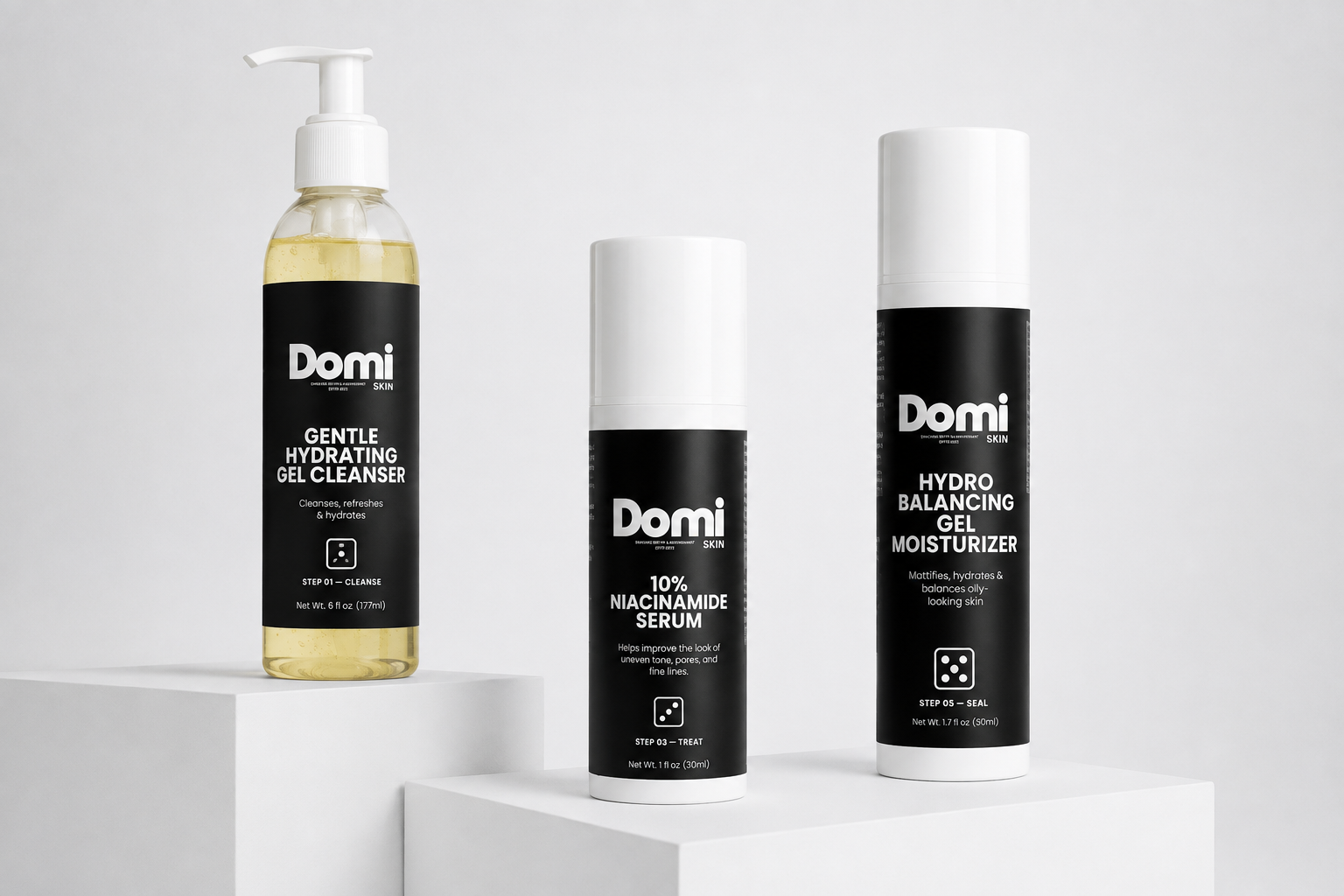 Three Domi skincare products displayed on white pedestals against a light gray background: a Gentle Hydrating Gel Cleanser in a clear pump bottle with yellow liquid, a 10% Niacinamide Serum in a black-and-white cylindrical bottle, and a Hydro Balancing Gel Moisturizer in a black-and-white aerosol can.